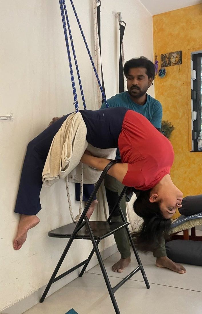 Instructor-assisted therapeutic yoga session at Breathing Point